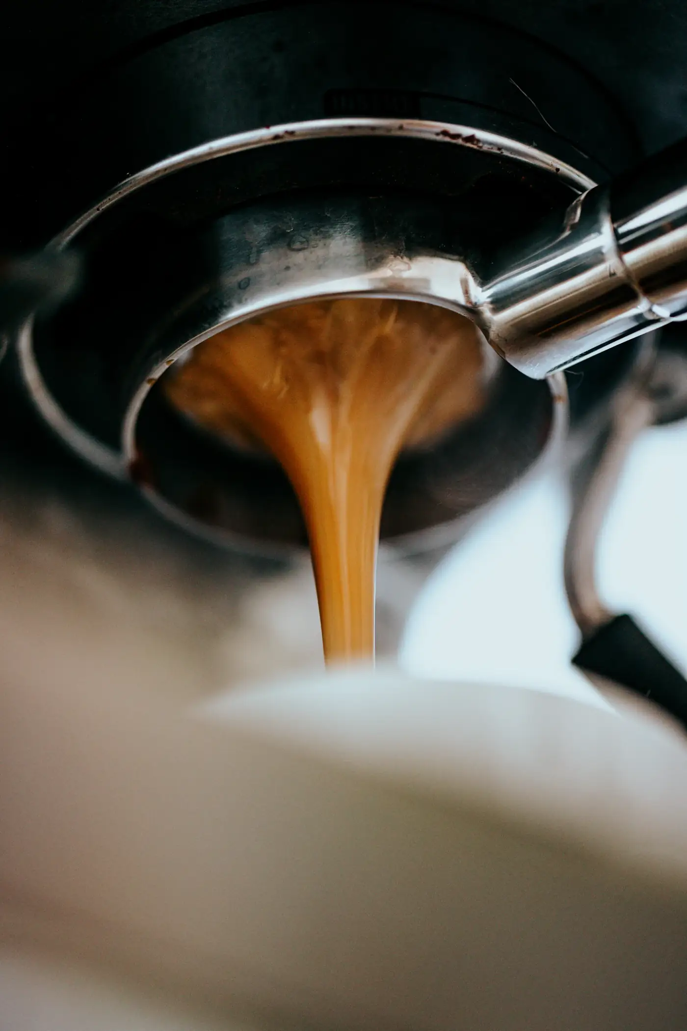 Espresso pouring from a portafilter