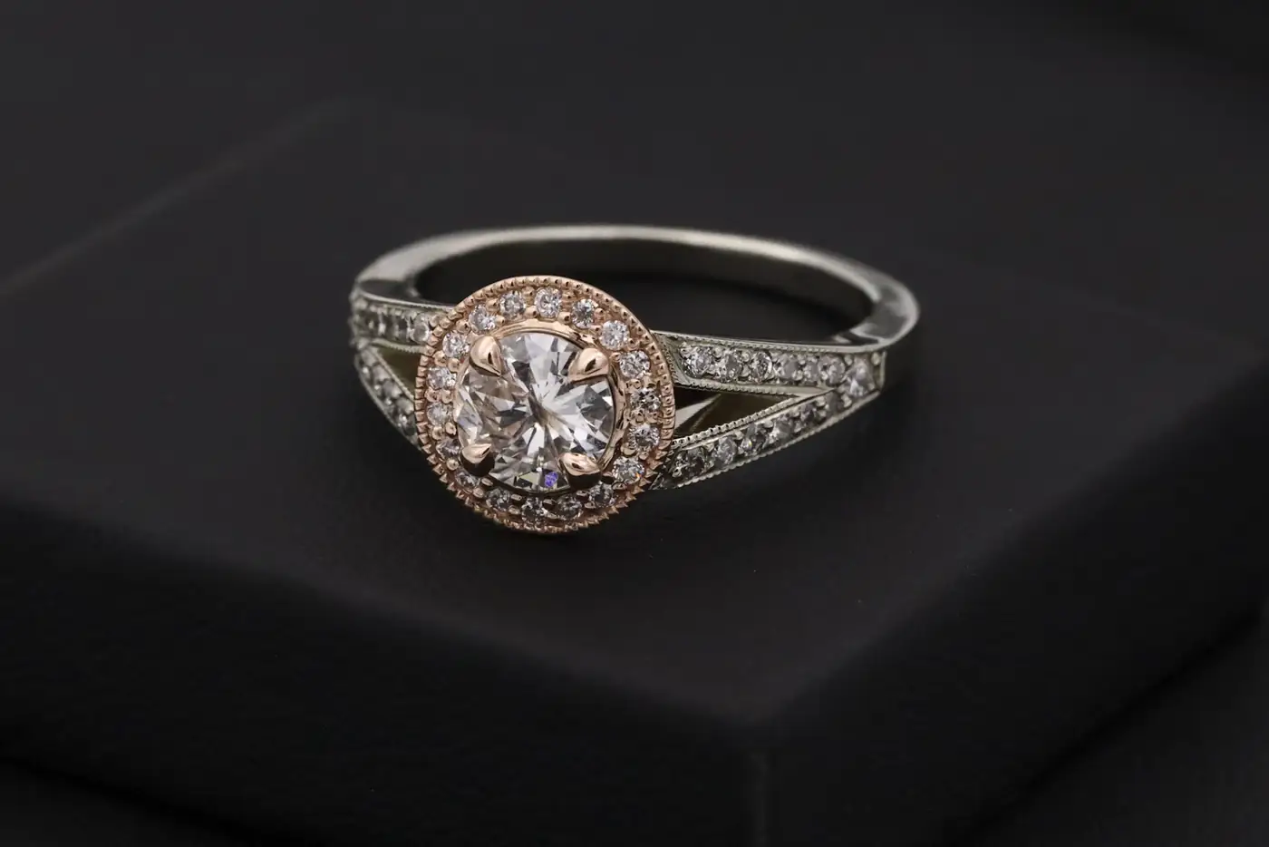 Vintage style halo diamond ring on black