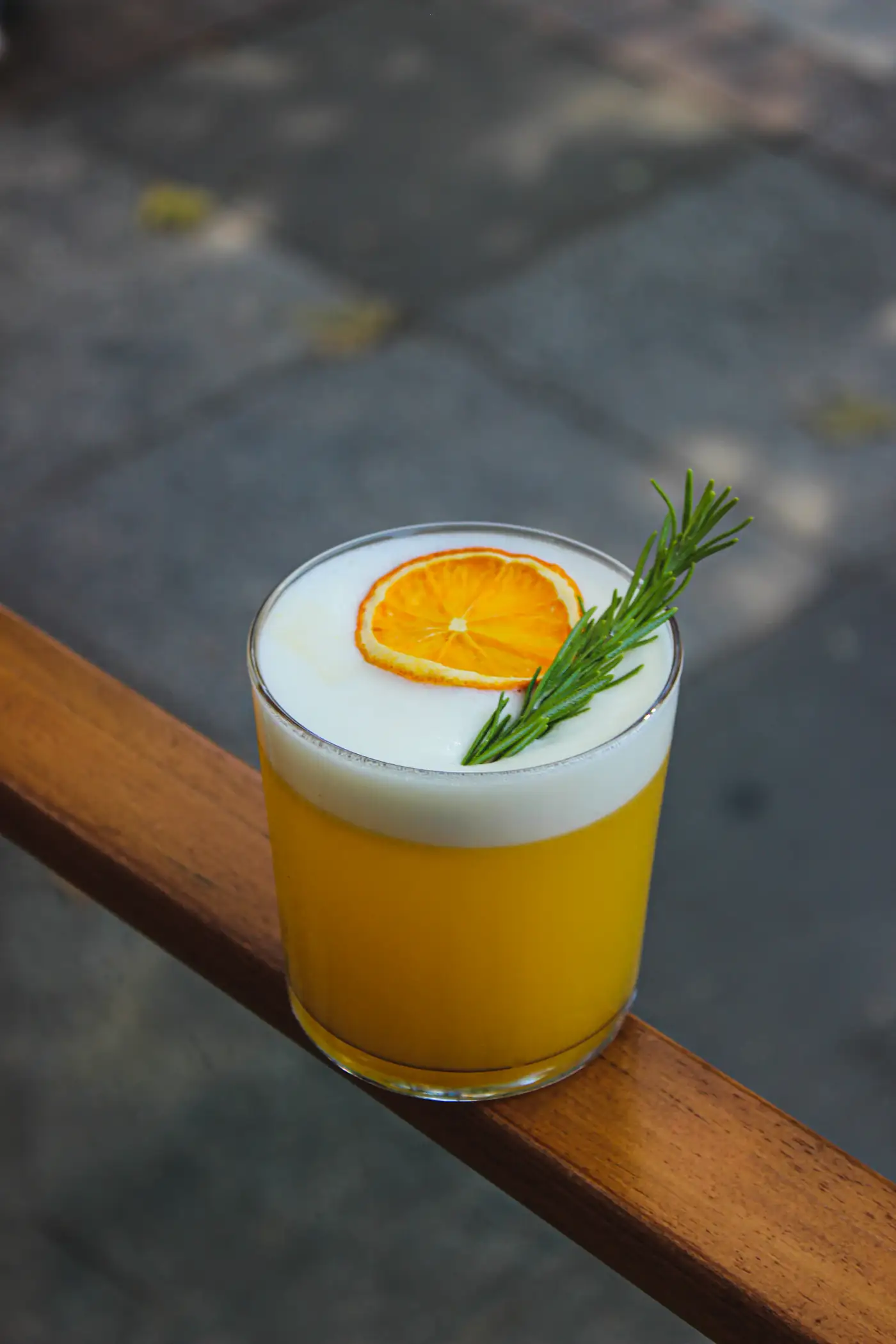 Orange cocktail with rosemary